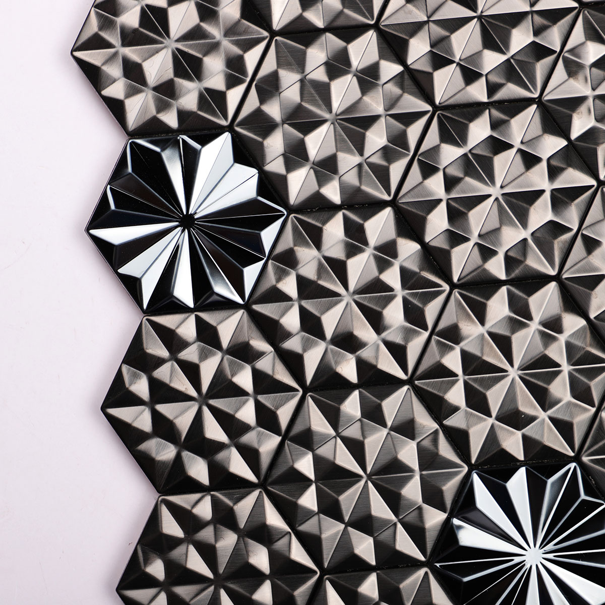Detailed close-up of black metal 3D groutless hexagon mosaic tile