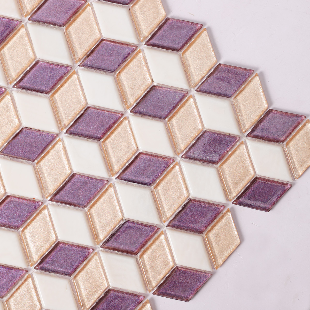Second close-up of pink and purple diamond-shaped glass mosaic tiles.