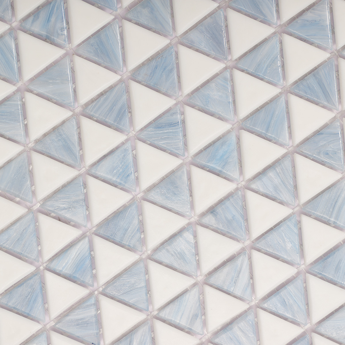 Close-up of blue and white checkerboard triangle glass mosaic tiles.