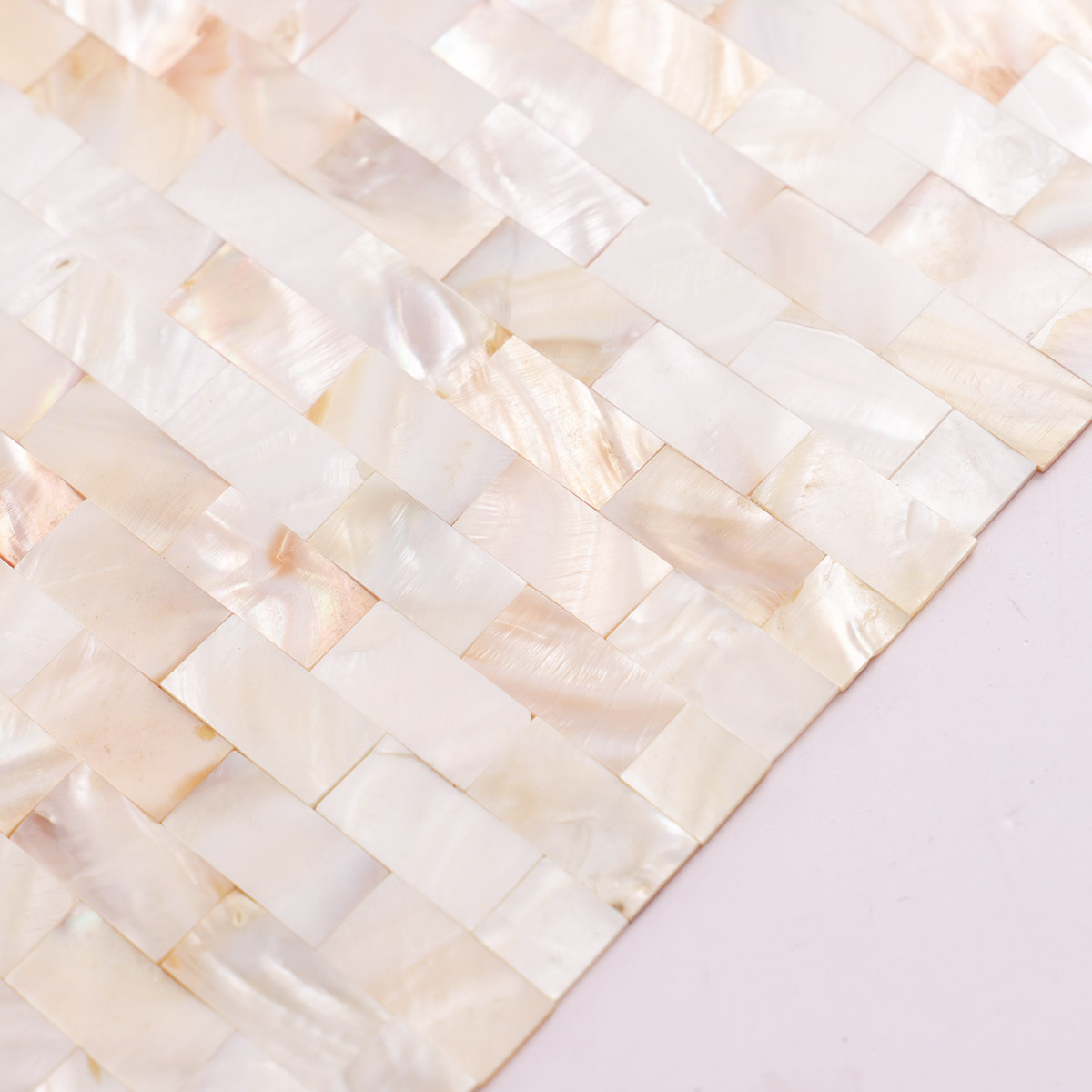 Local close-up of tight joint mother of pearl subway mosaic tiles