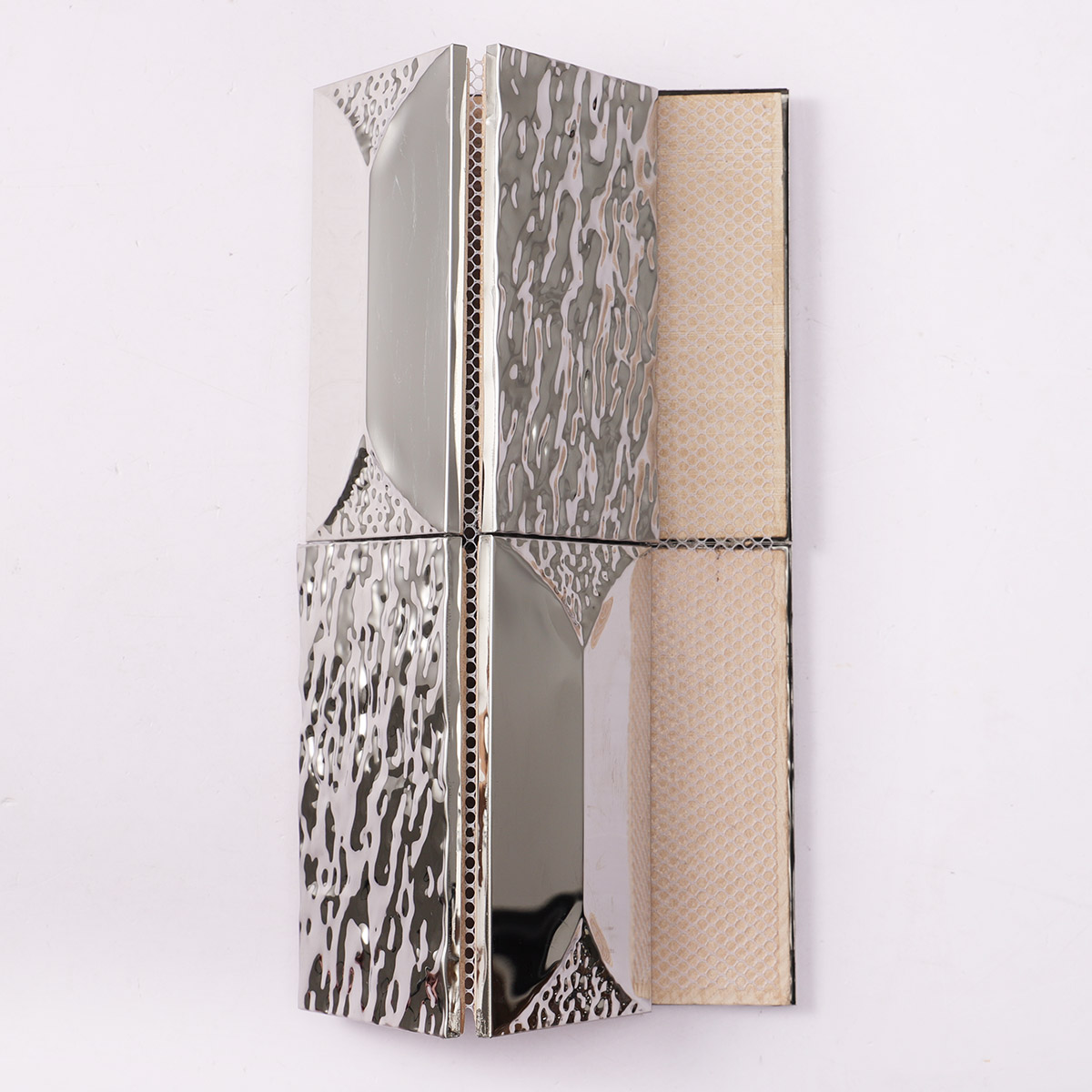 Back side of 3D stainless silver rectangle mosaic, showing fold