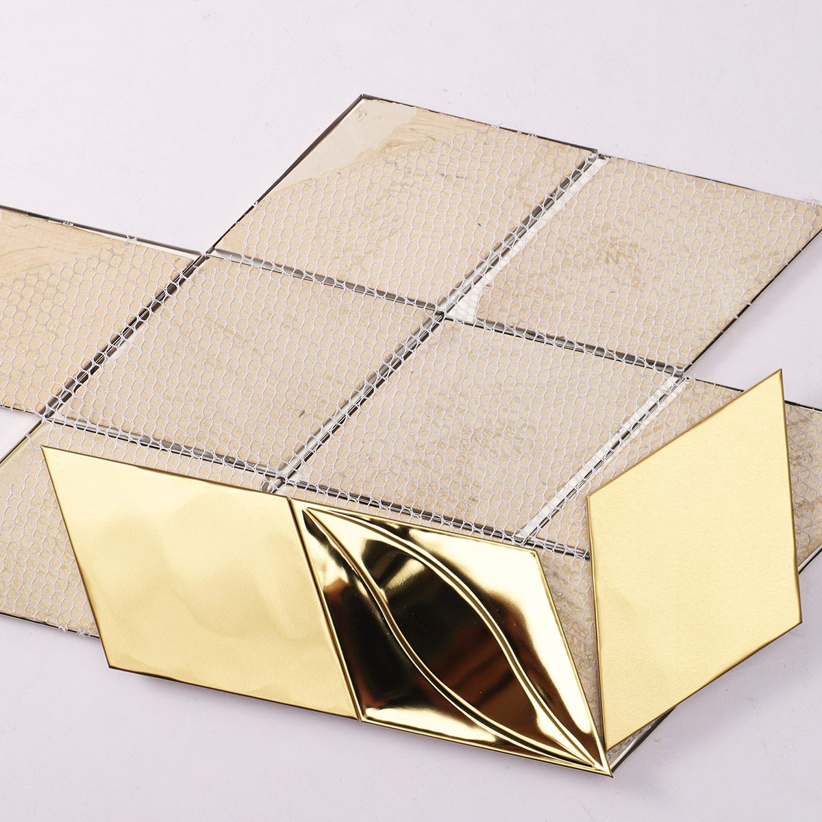 Back side of 3D golden diamond stainless steel mosaic, fold, mesh mounted