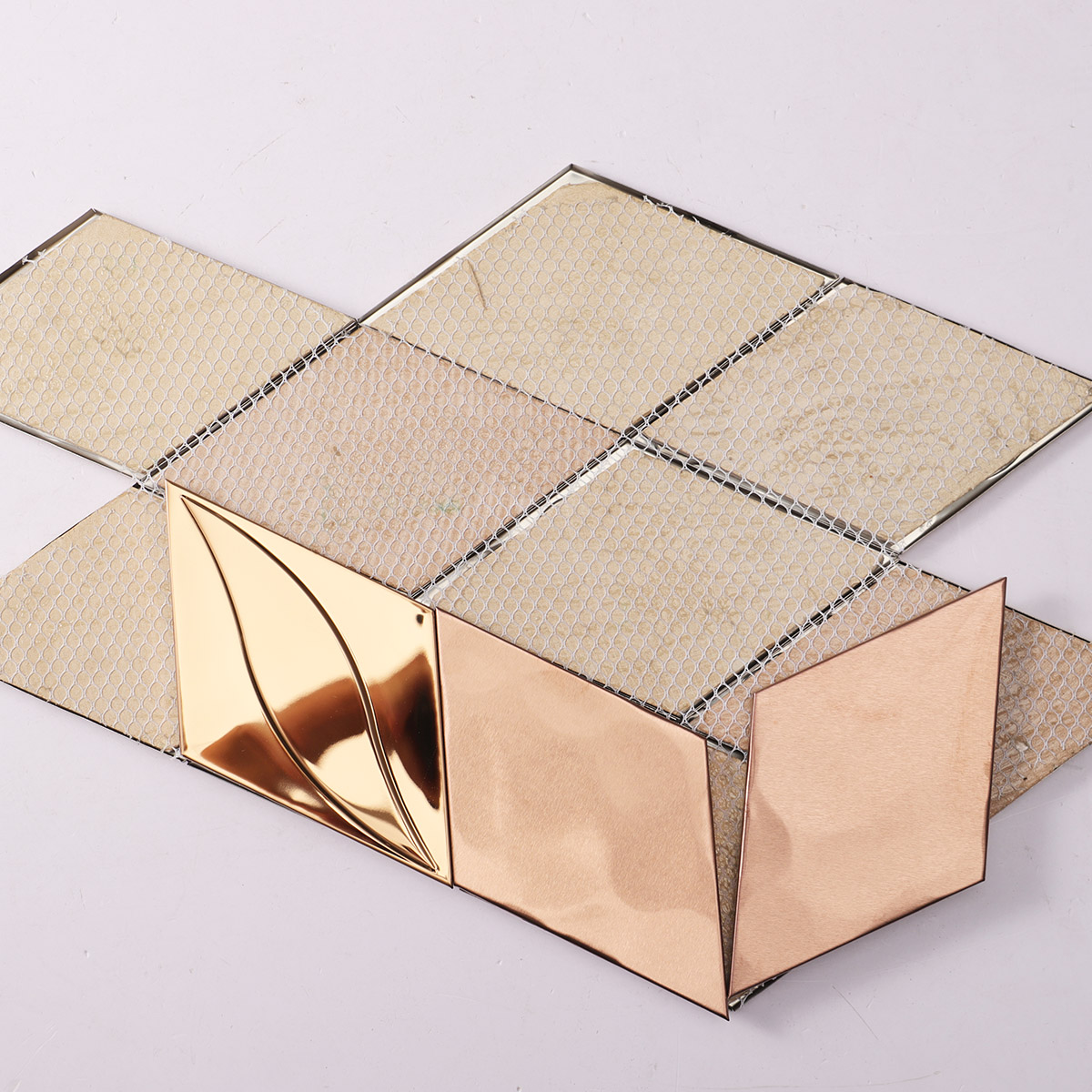 Back side of rose gold diamond metal mosaic, fold, mesh mounted