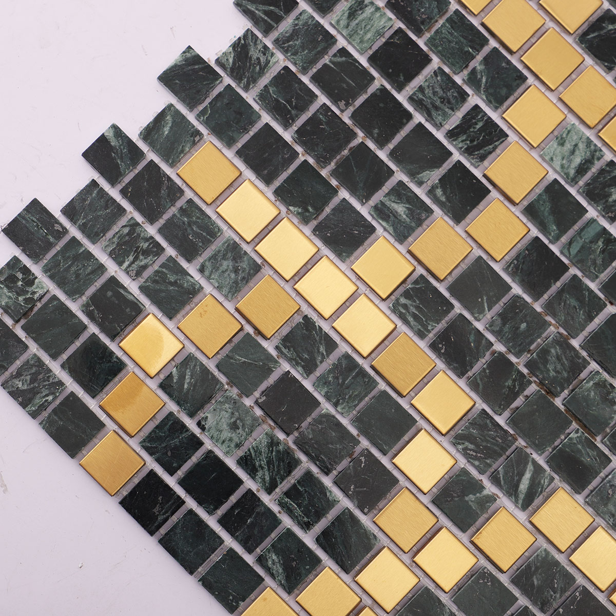 Close-up of green marble and metal pixel art mosaic tiles