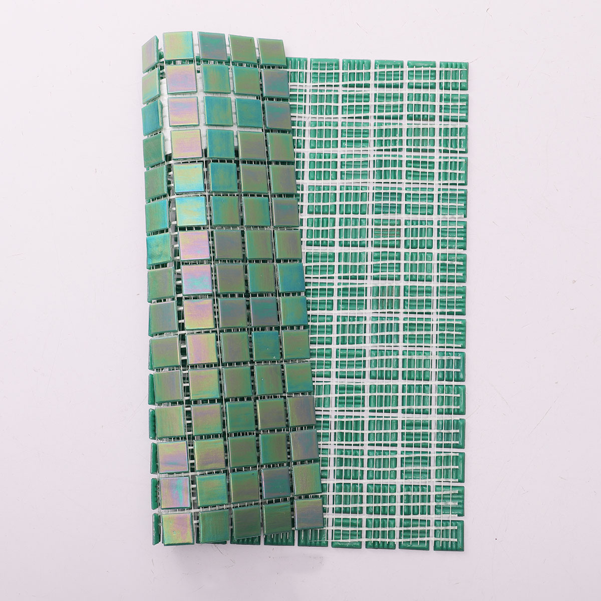 Back side of glossy iridescent emerald green square mosaic tiles, mesh mounted
