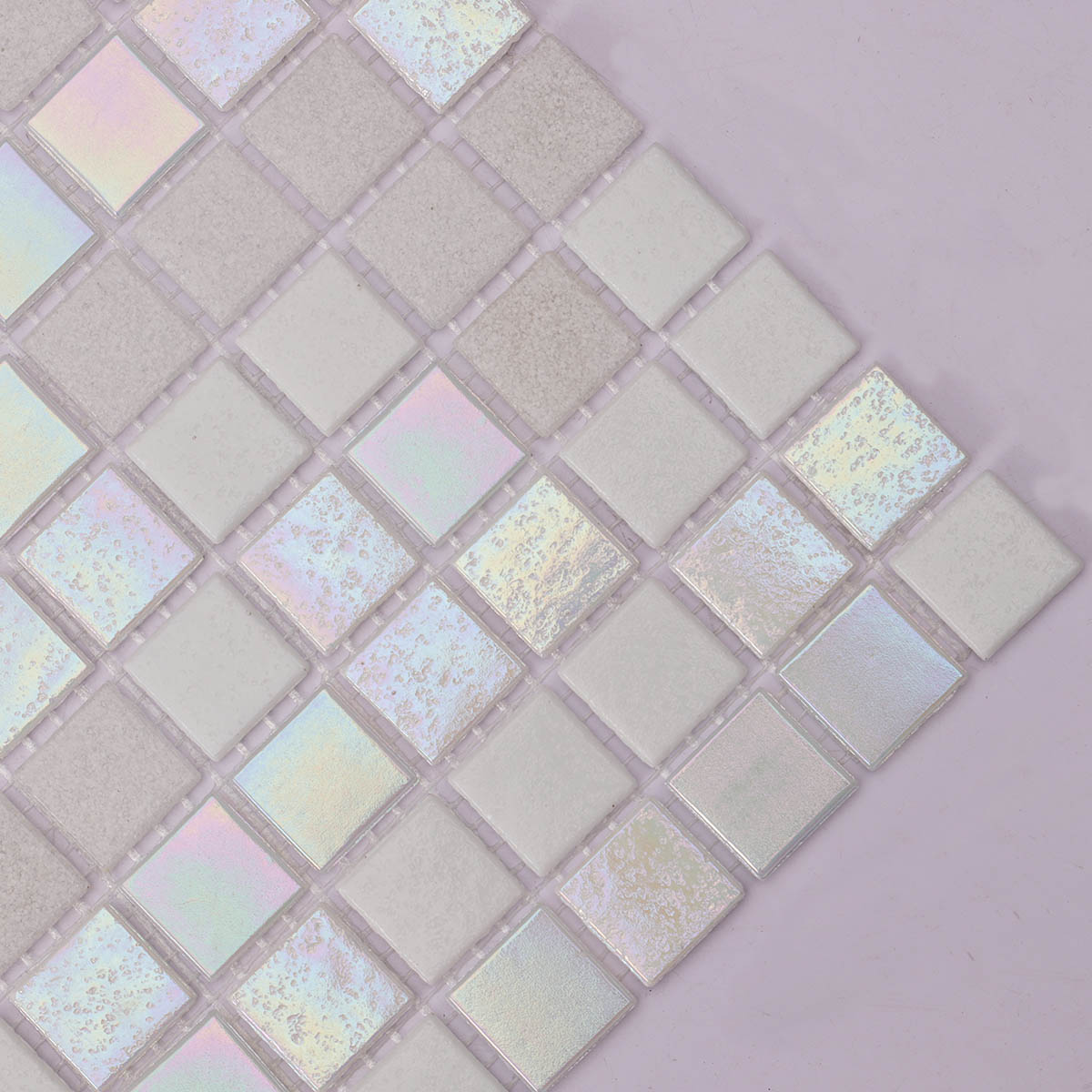 Close-up side view of shining white square glass mosaic tiles
