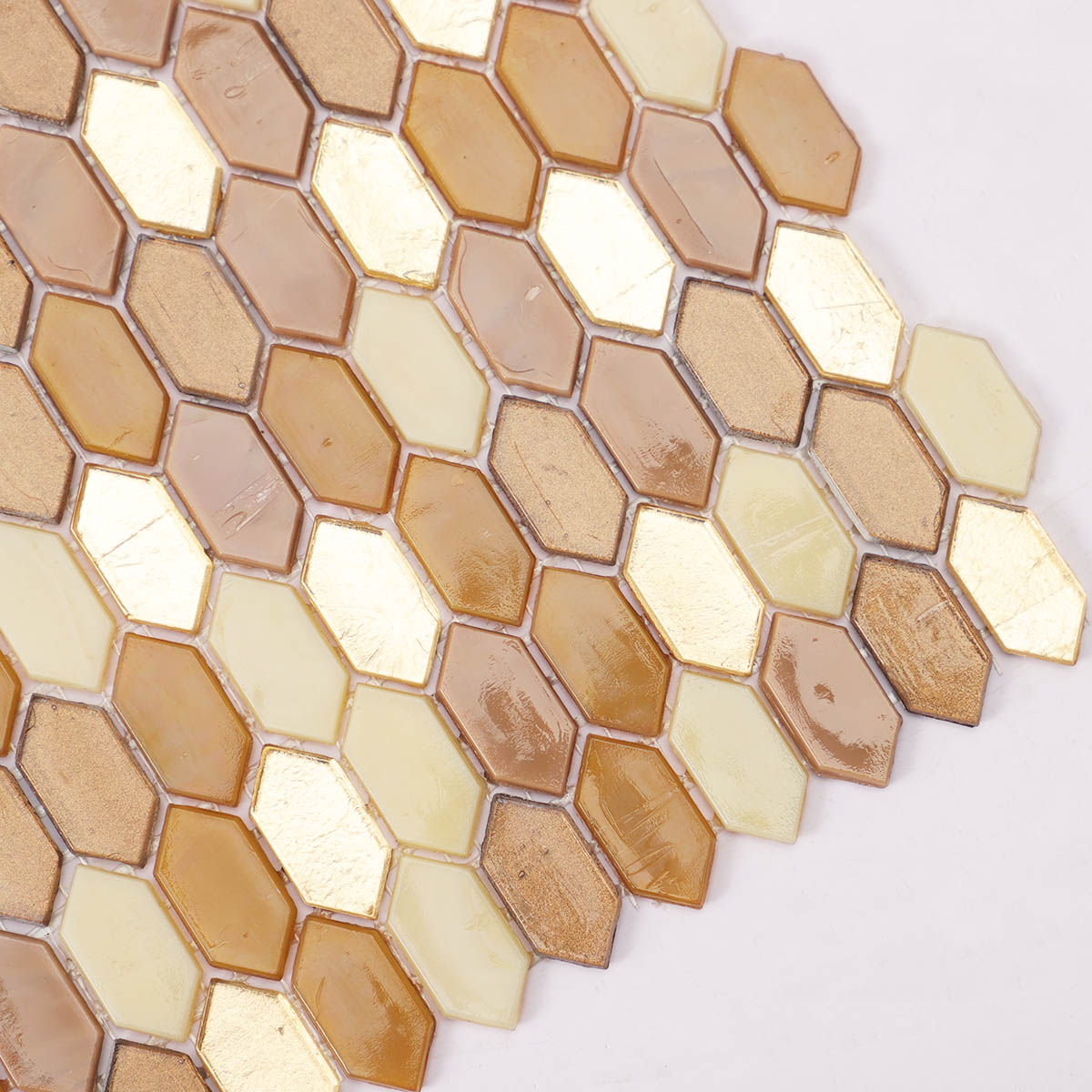 Side close-up of brown and flicker gold picket glass mosaic tiles