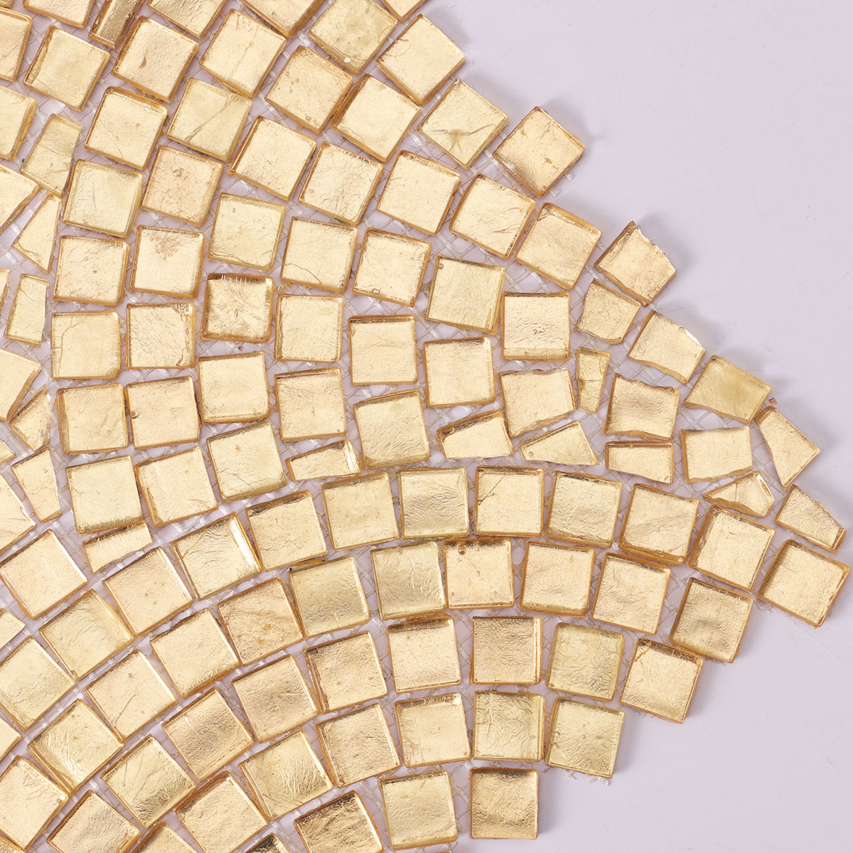 Detailed close-up of gold glass mosaic art designs