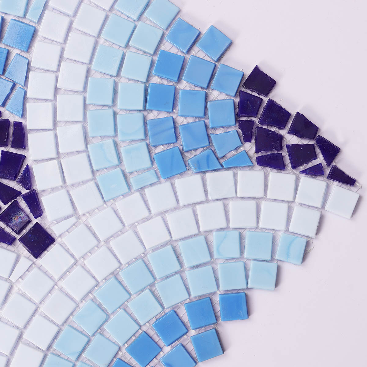 Close-up of blue scale glass mosaics with cutting art