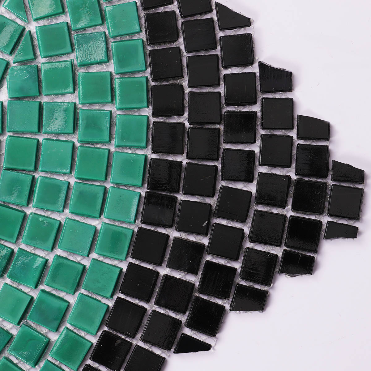 Close-up of glass mosaic tiles with hand-cut art patterns