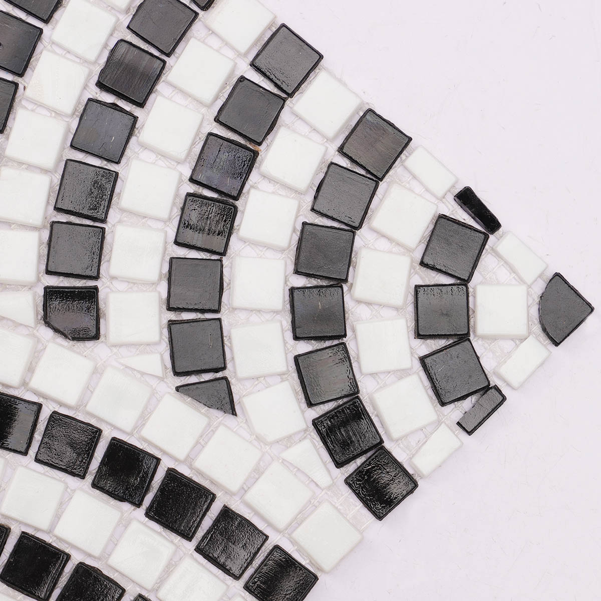 Close-up of white and black scale glass mosaic tiling art