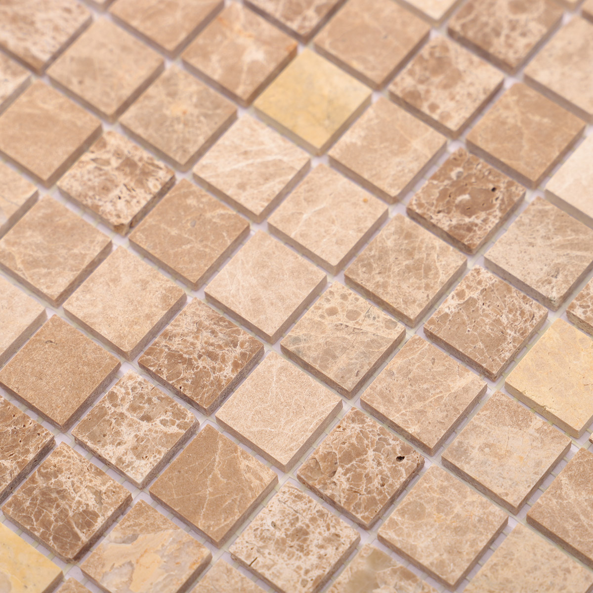 Close-up view of Emperador light polished marble mosaic tiles.