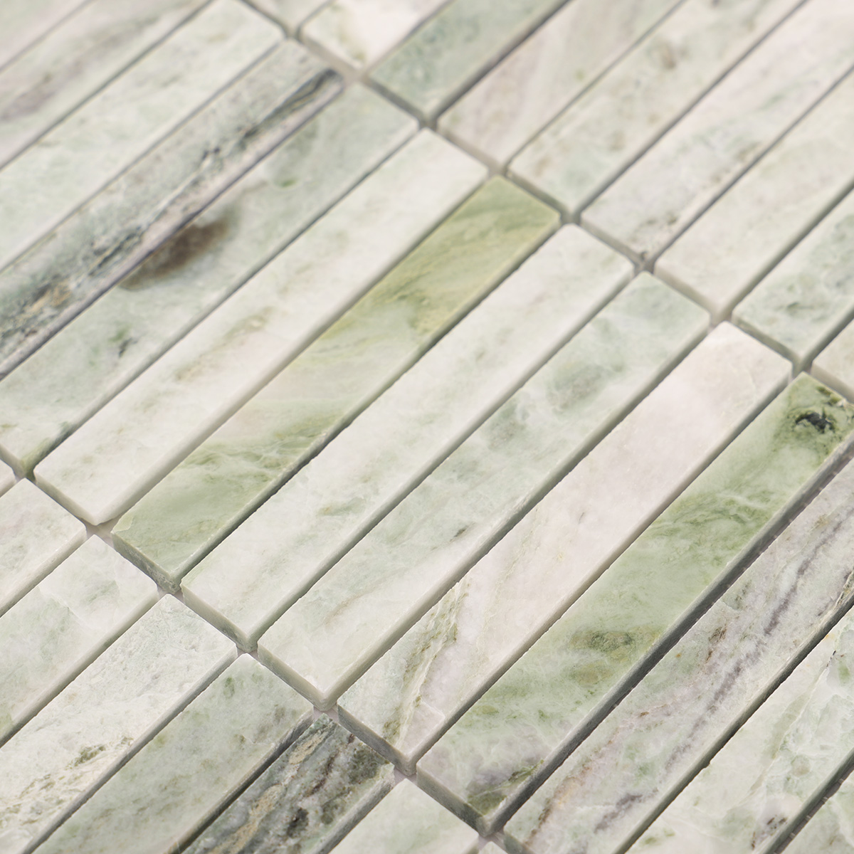 Detailed close-up of Ming green marble polished mosaic tiles.