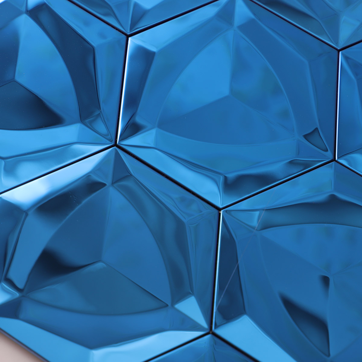 Close-up of 3D blue hexagon stainless steel mosaic tiles.