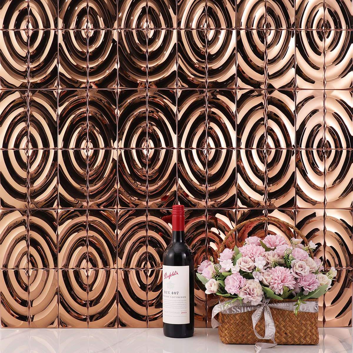 Living room wall with 3D wave rose gold stainless steel mosaic tiles.
