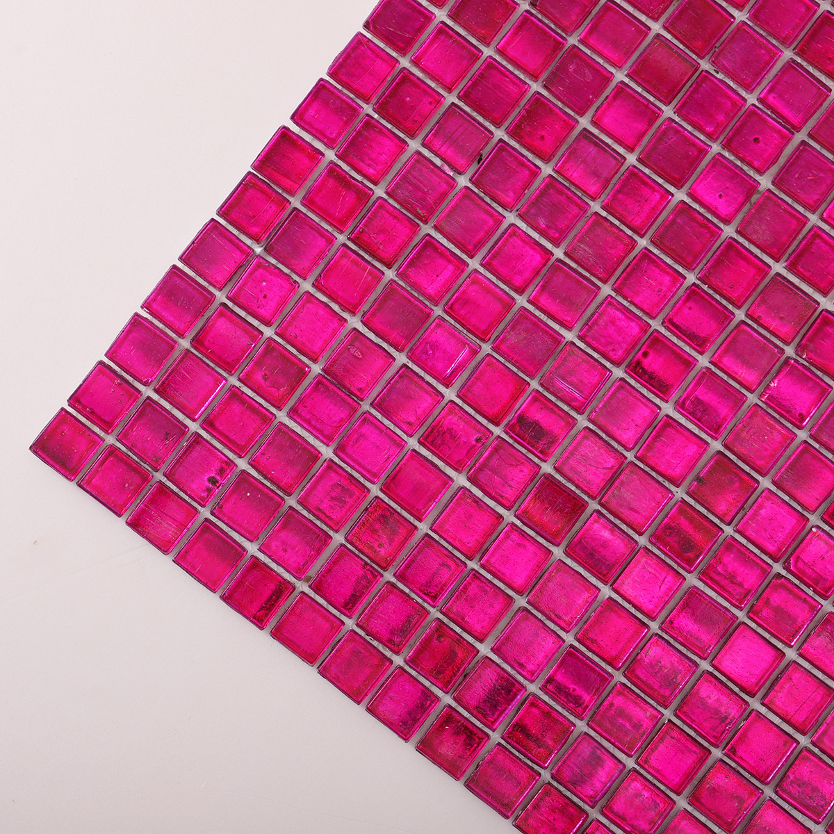 Detailed close-up of dark pink foil glossy square glass mosaic tiles.