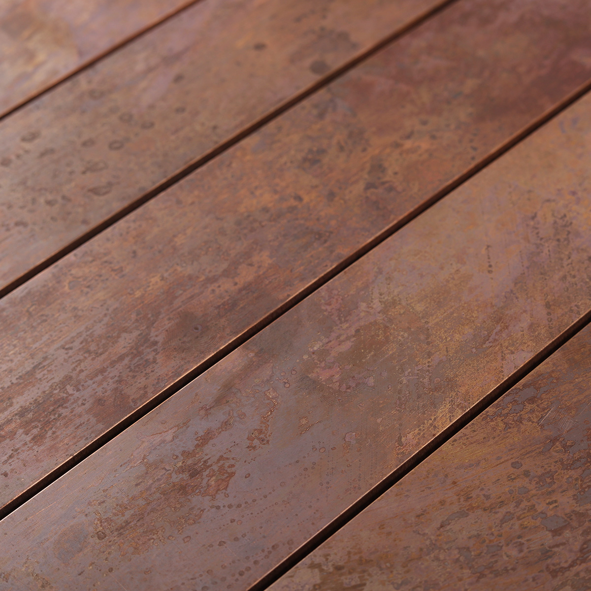 Close-up of copper rust matte brick metal mosaic tiles.
