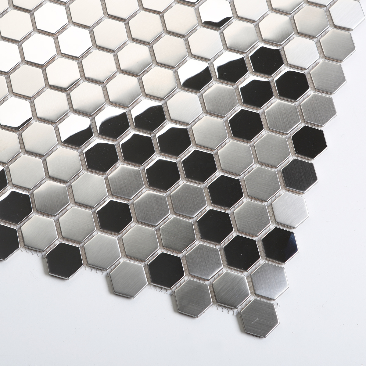 Detailed close-up of silver hexagon stainless steel mosaic tiles.