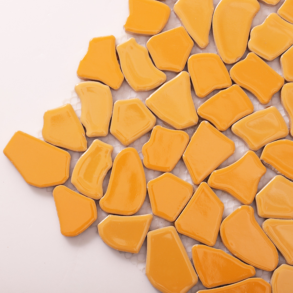 Close-up view of cracked ceramic mosaic art tiles.