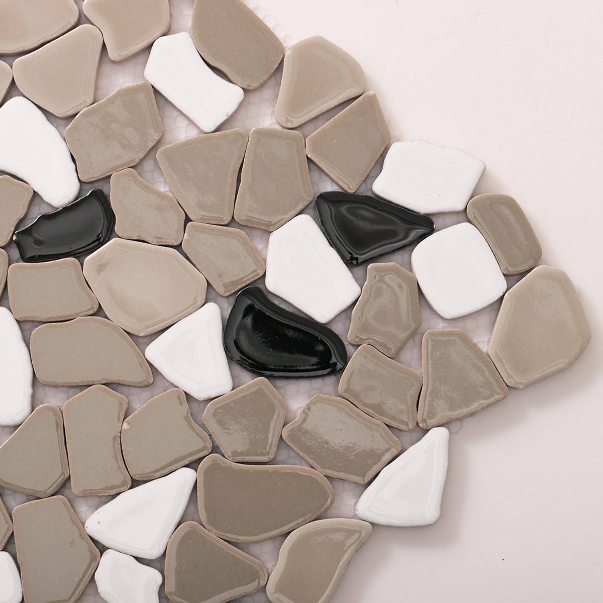 Detailed close-up of glossy grey ceramic cracked mosaic tiles