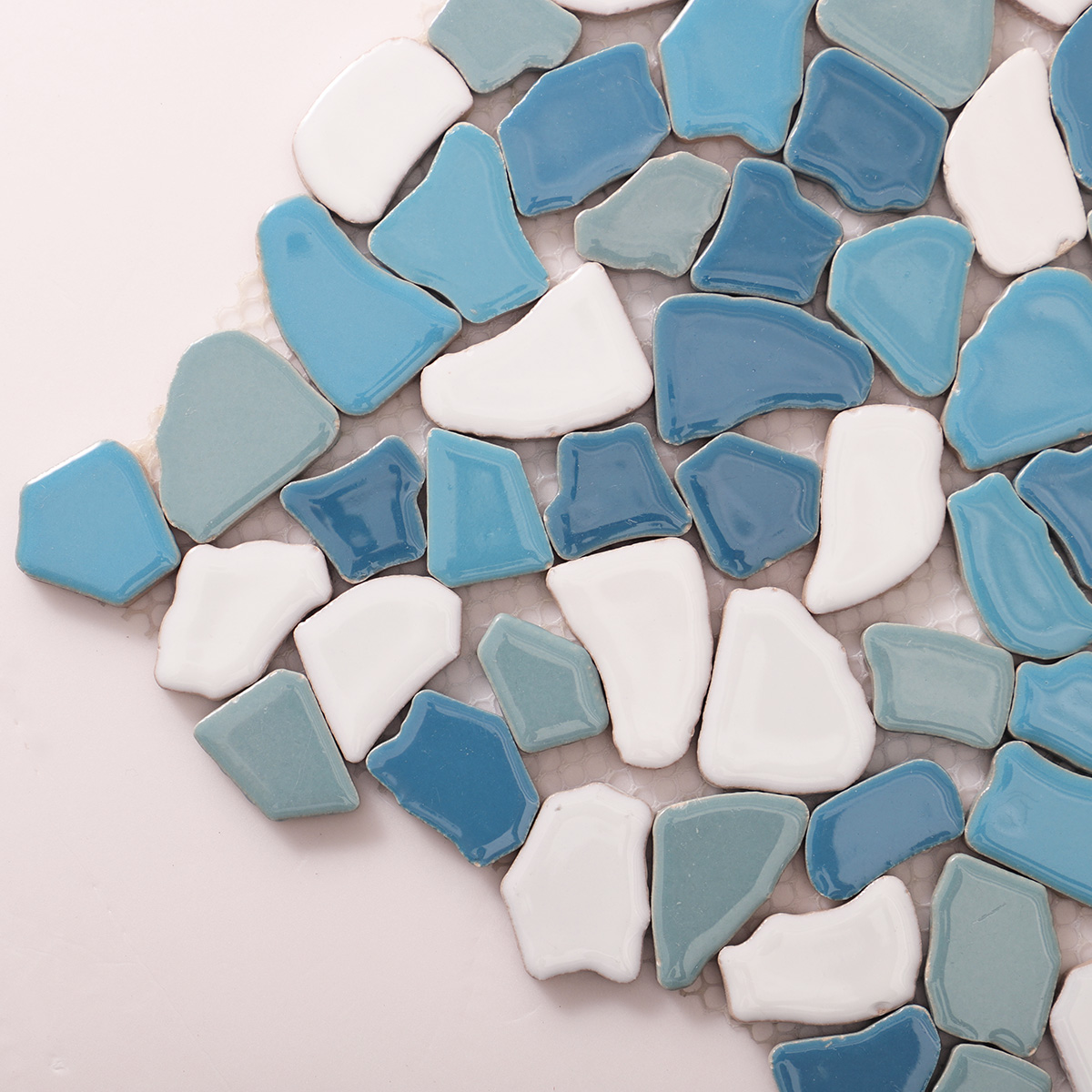 Close-up of irregular broken ceramic pebble mosaic tiles.