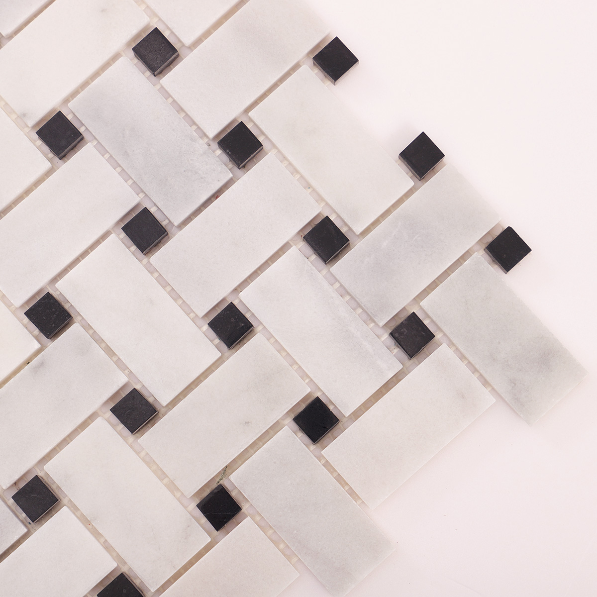 Macro close-up of Carrara white basketweave marble mosaic tiles
