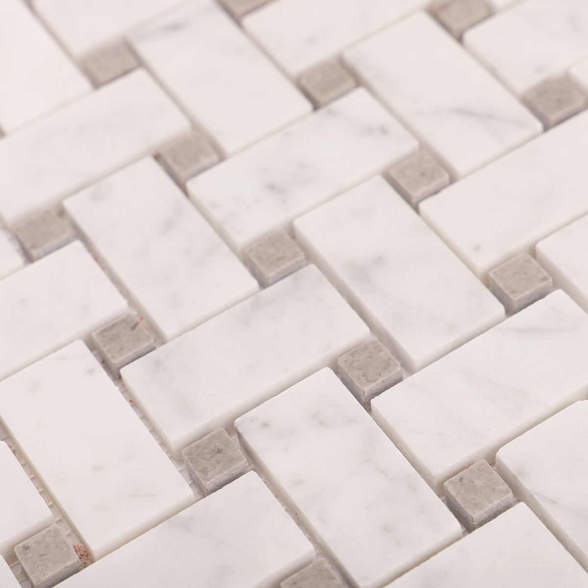 Detailed close-up of Carrara white basketweave marble mosaic tiles