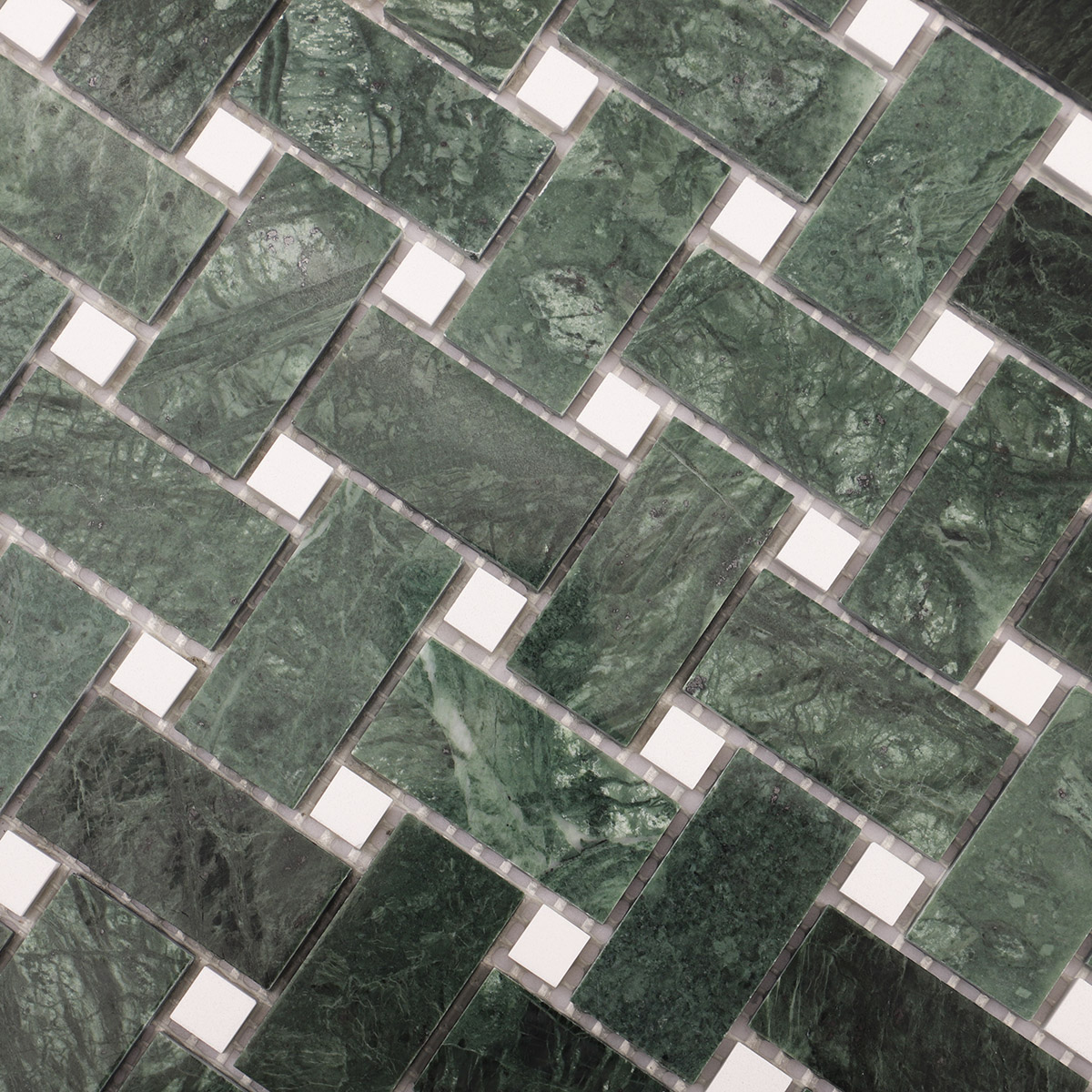 Macro close-up of Verde green basketweave marble mosaic tiles.