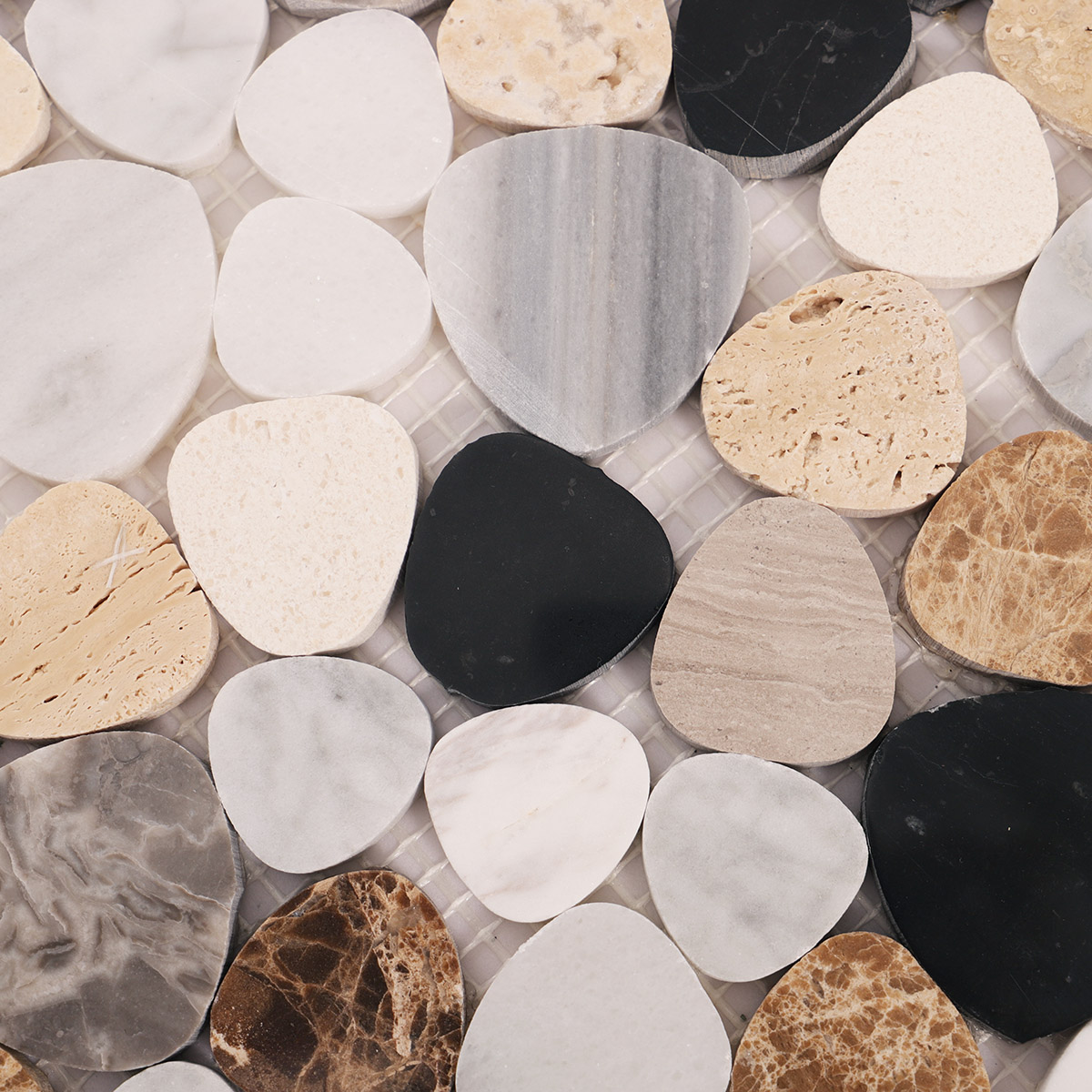 Detailed close-up of mix pebble marble mosaic tiles.