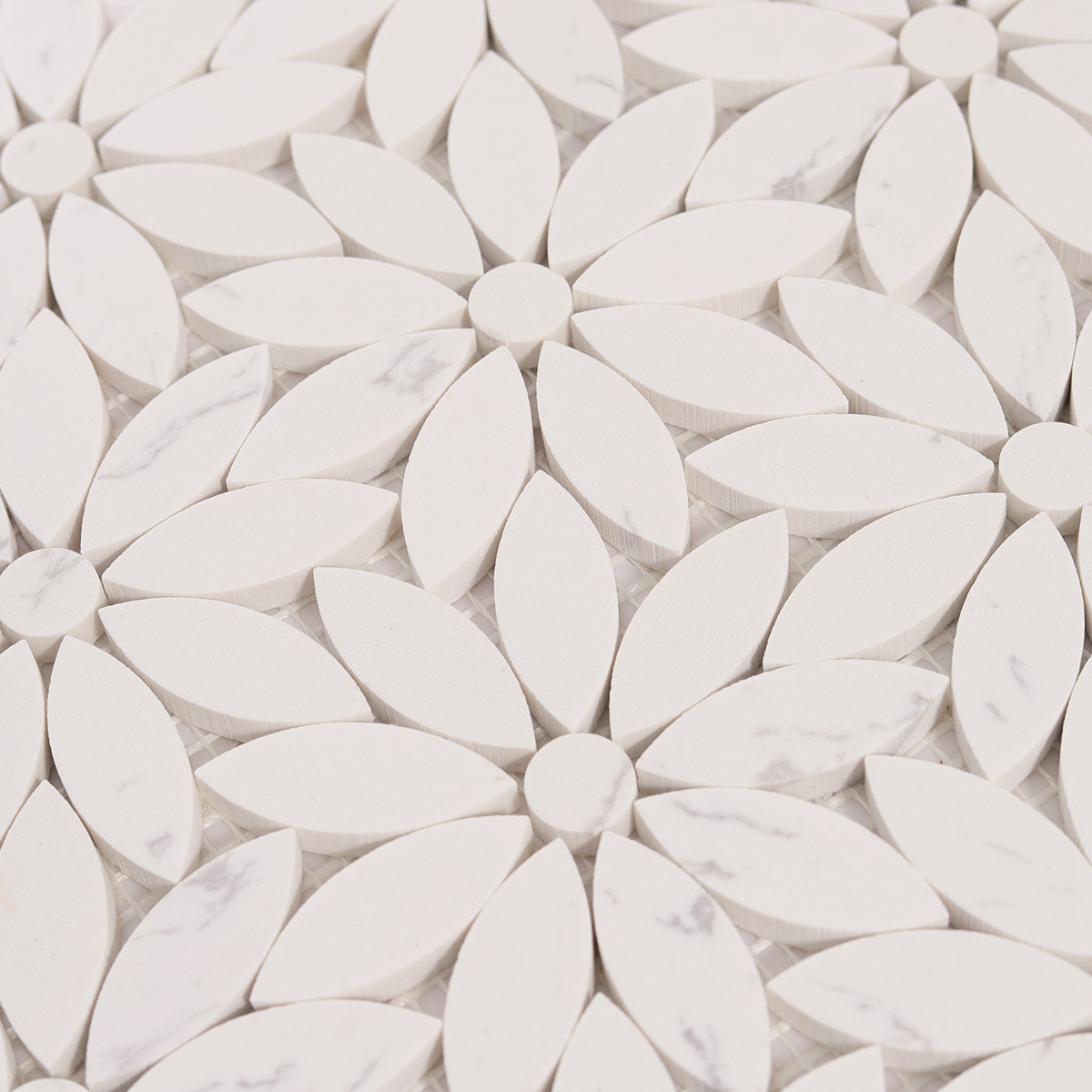 Close-up of white daisy waterjet marble mosaic tiles