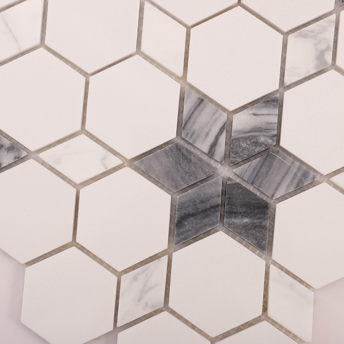 Close-up view of white and grey flower marble mosaic tiles