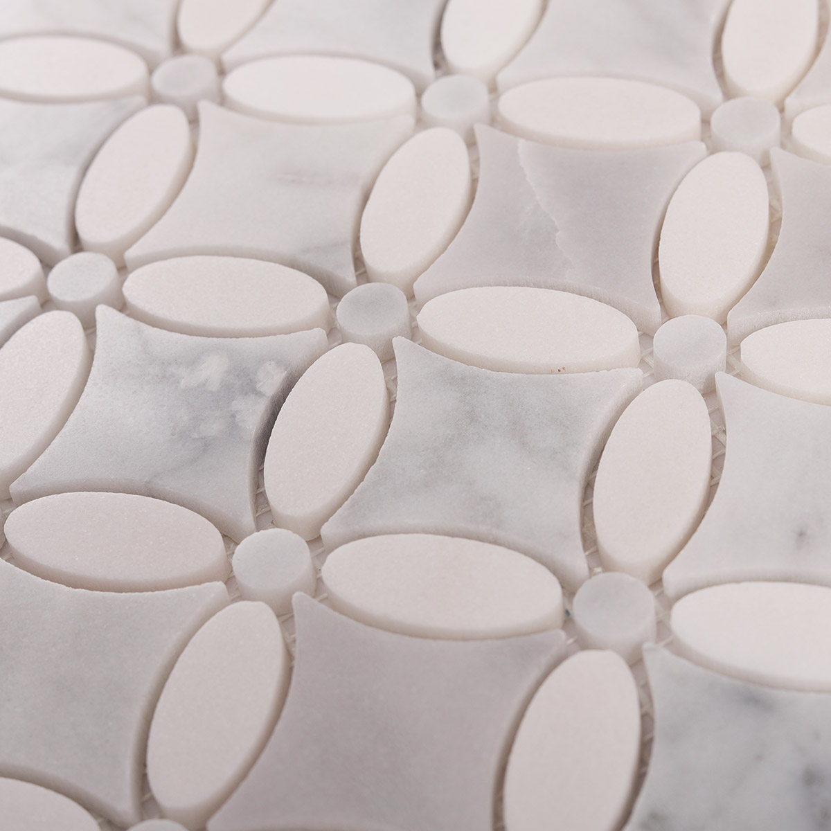 Close-up of Carrara white flower marble mosaic tiles