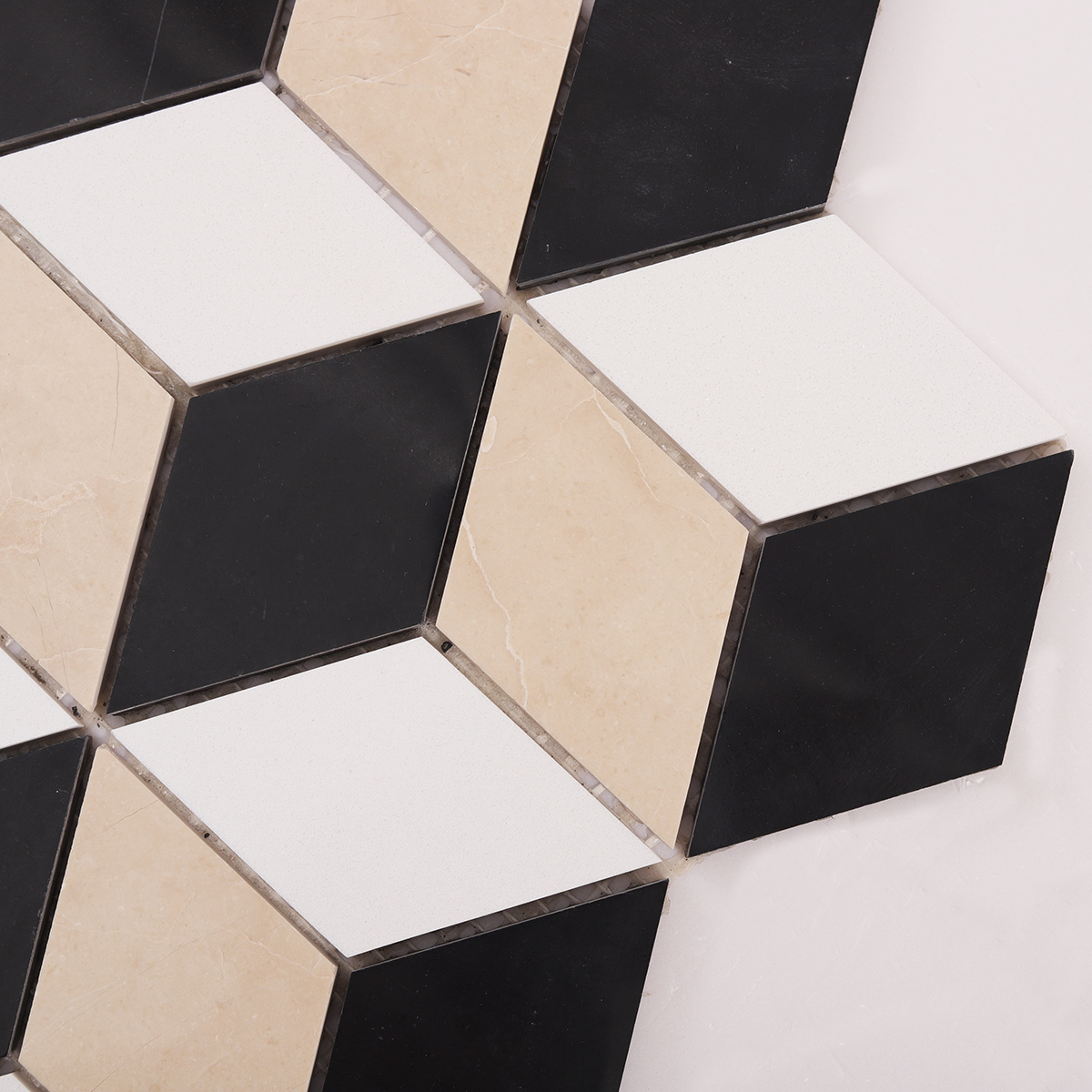 Detailed close-up of diamond cube black and white marble mosaic tiles