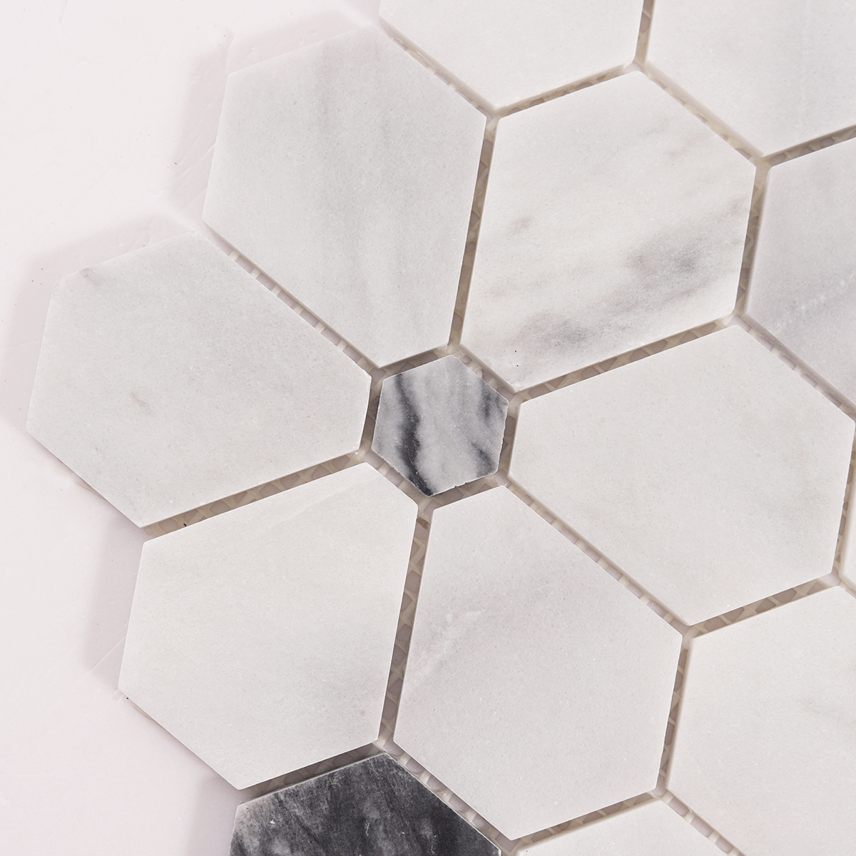 Close-up of Carrara white hexagon flower marble mosaic tiles