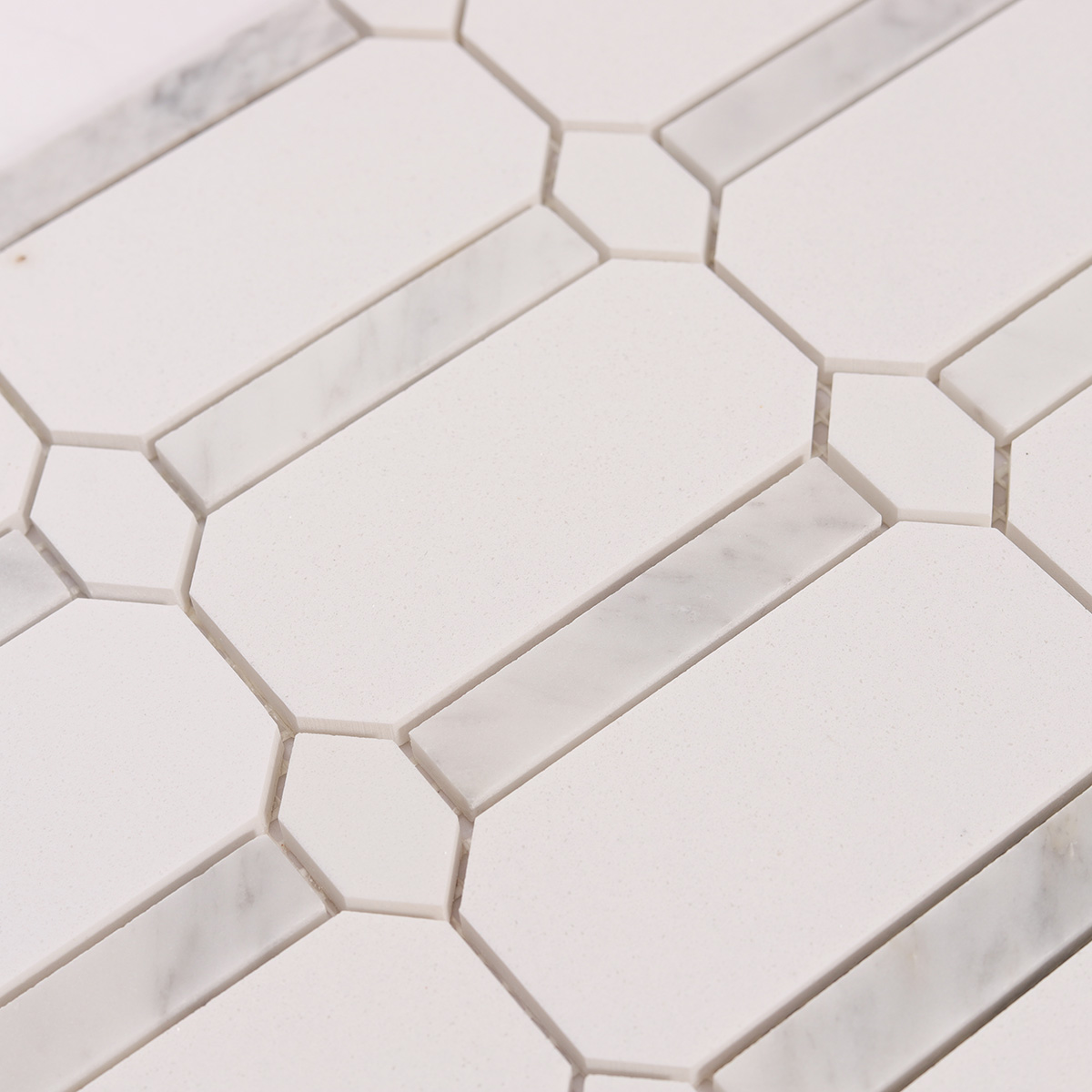 Close-up view of white octagon marble mosaic tiles