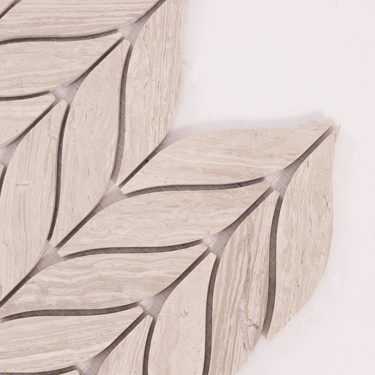 Detailed close-up of Grigio Legno leaf shape marble mosaic tiles.