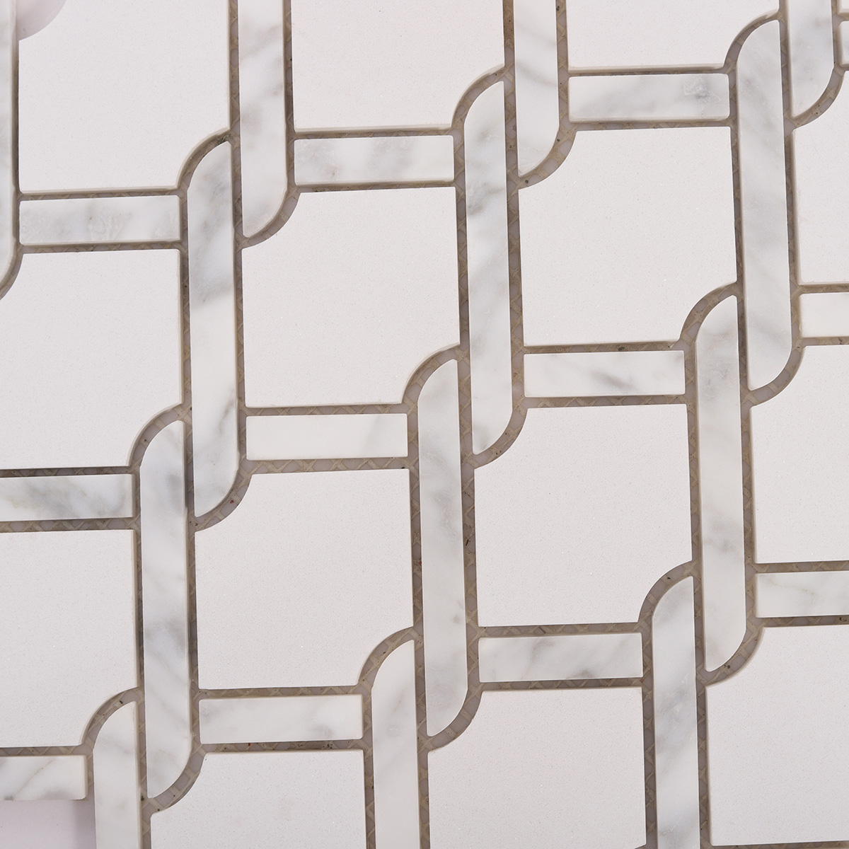 Close-up view of White Fog Chain Link stone mosaic tiles