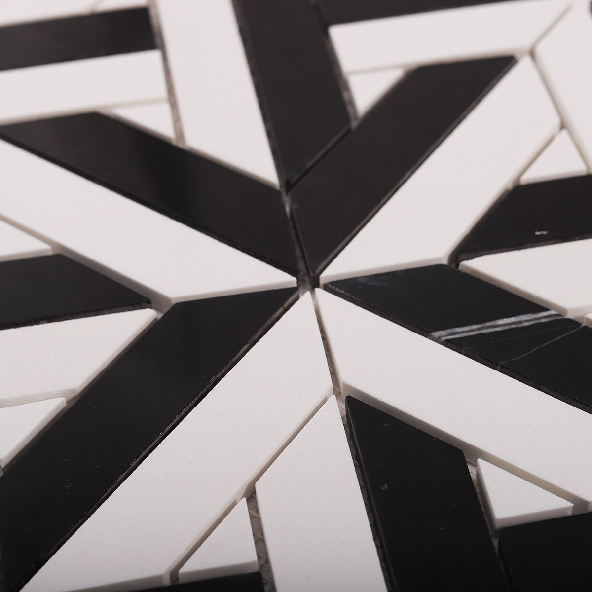 Detailed close-up of White and Black Geometrica polished marble mosaic tiles