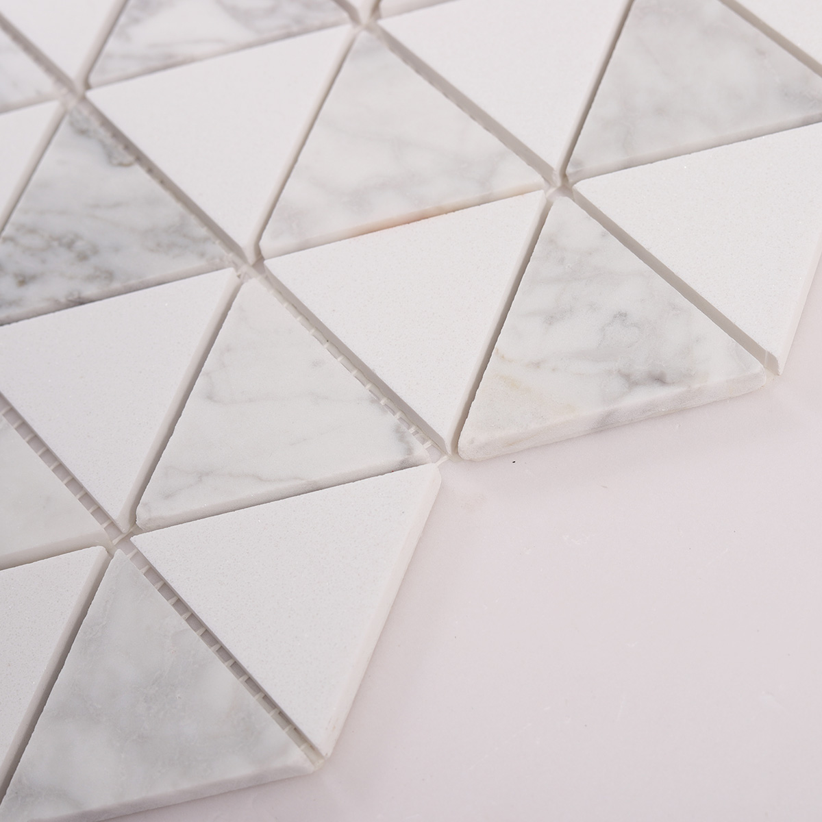 Side close-up view of White Equilateral Triangle Honed Stone Mosaic Tiles
