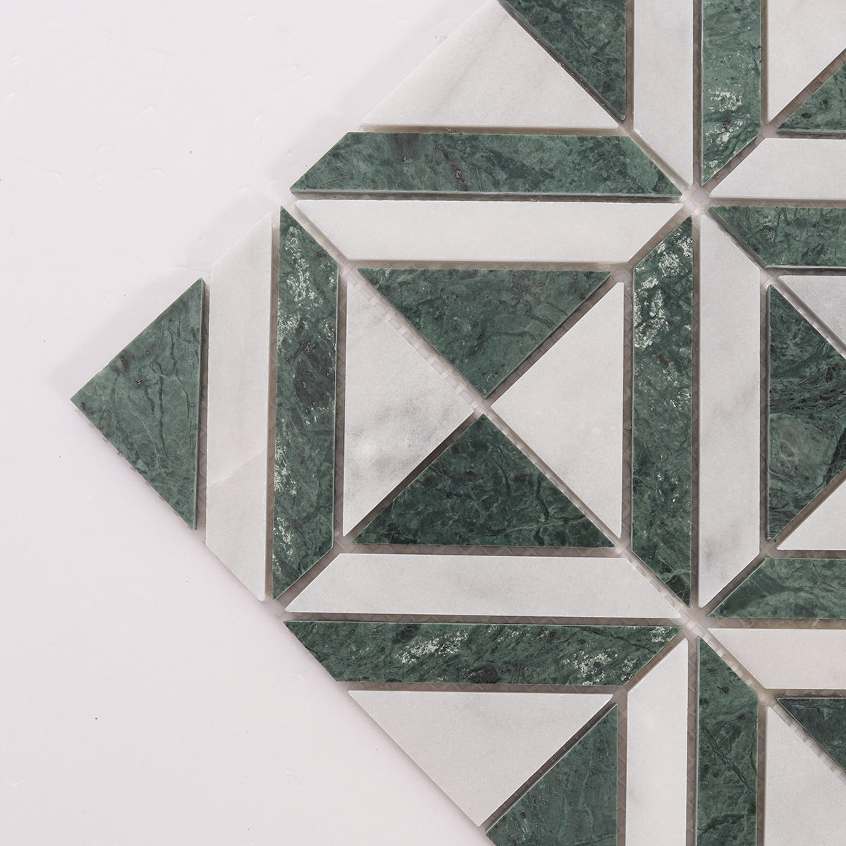 Close-up of Green & White Triangle Marble Mosaic Tiles