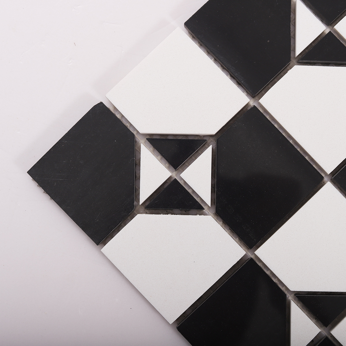 Close-up of Black and White Polished Marble Mosaic Tiles