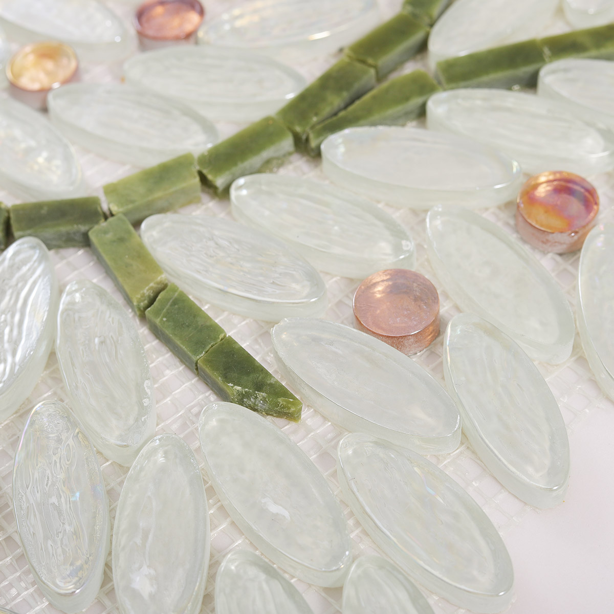 Close-up of White Oval Glass Mosaic Art Tiles