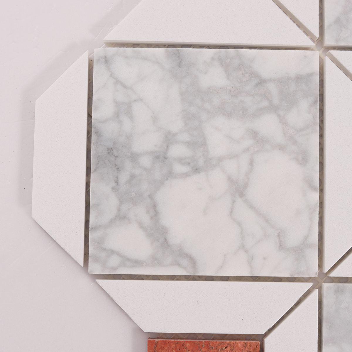 Close-up of White and Red Polished Marble Mosaic Tiles