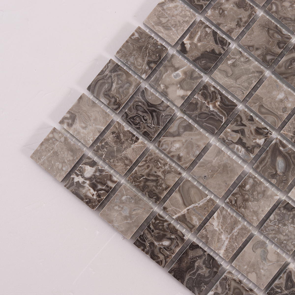 Close-up of Emperador Light Brown Square Marble Mosaic Tiles.