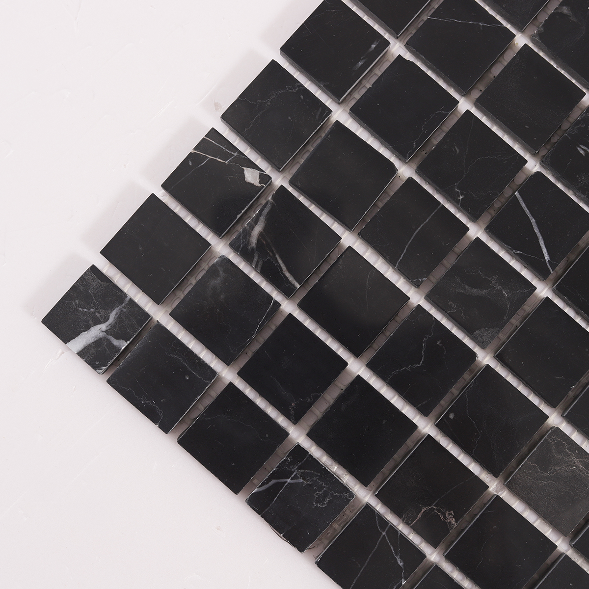 Detailed close-up of Nero Marquina Square Black Polished Marble Mosaic Tiles.
