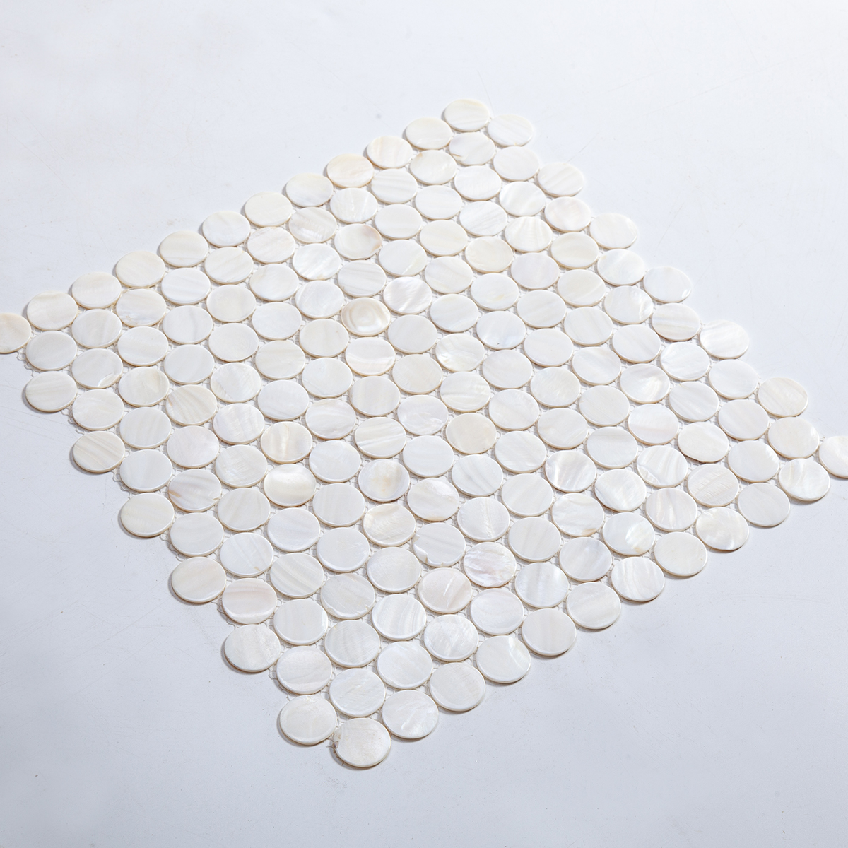 Close-up of Penny White Natural Pearl Shell Mosaic Tile, texture detail