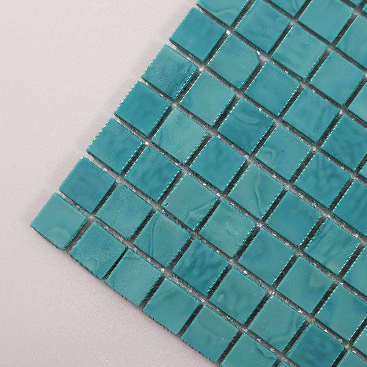 Detailed view of Light Blue Square Glass Mosaic Pool Tile, showing smooth surface