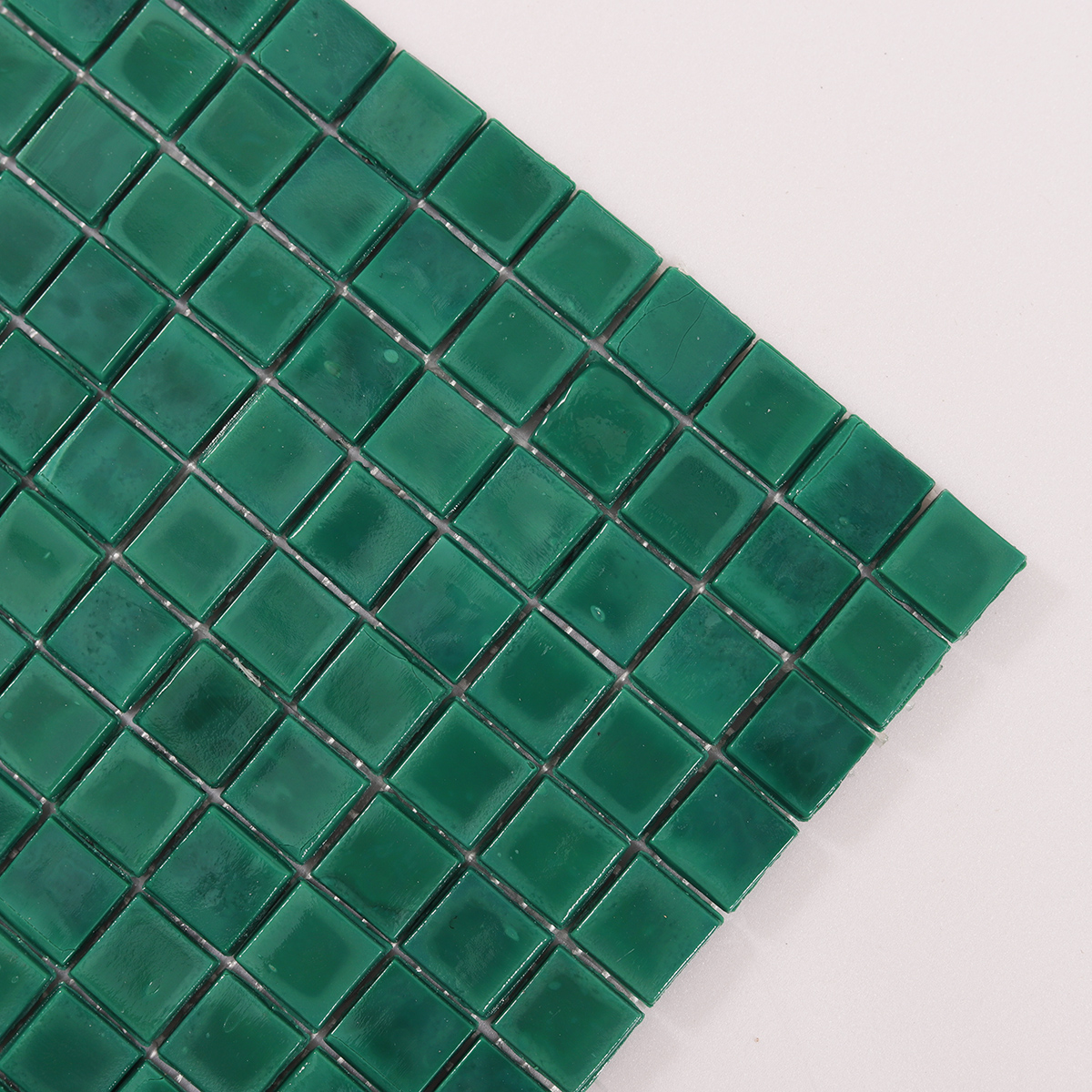 Close-up of Dark Green Uniform Square Glass Mosaic Bathroom Tiles, texture detail