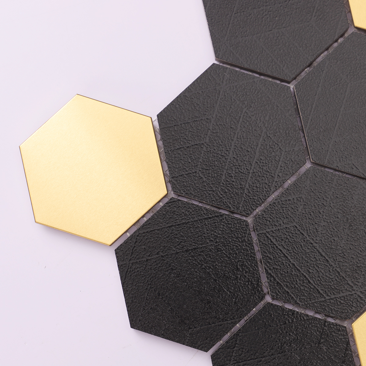 Close-up of Black and Gold Hexagon Ceramic Metal Mosaic Tile, texture detail