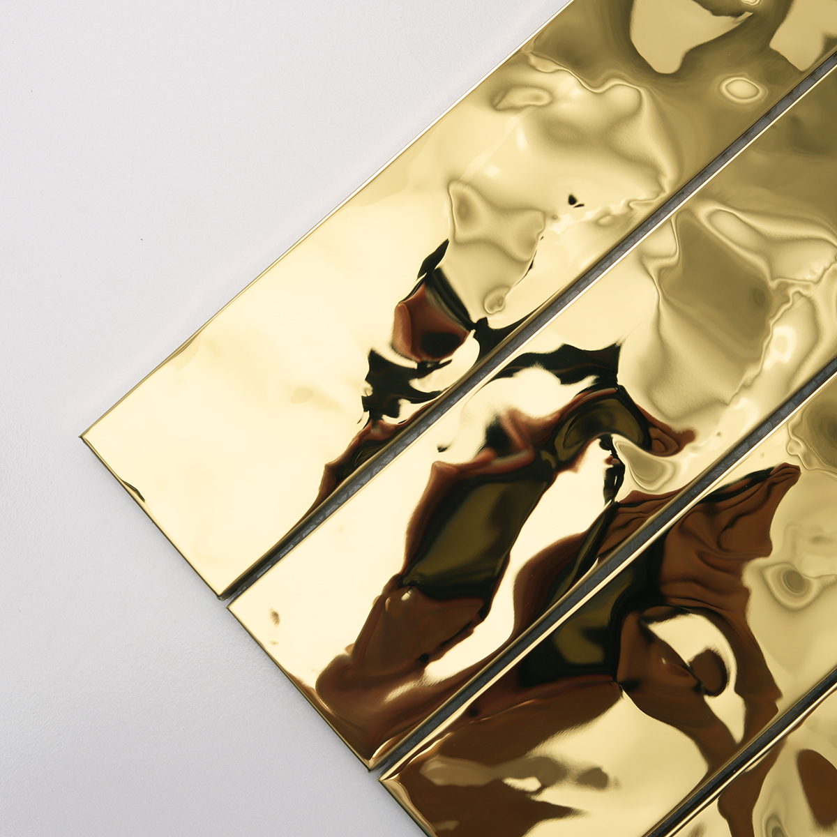 Detailed view of Gold Wave Stainless Steel Brick Mosaic Tiles, showing wave pattern